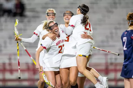 Lexi Dupcak, Kristen Shanahan, and Jordyn Lipkin celebrate a goal agaisnt Penn at SECU Stadium