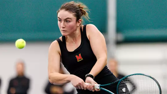 Tamari Gagoshidze hitting a shot during a Maryland tennis match