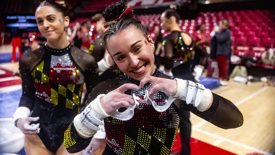 Aine Read making a heart shape with her hands following a routine