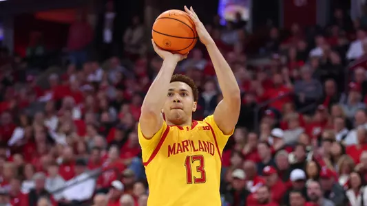 Elijah Saunders Shoots a Three-Point Shot Against Wisconsin