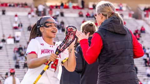 Kennedy Major giving a high five to Cathy Reese