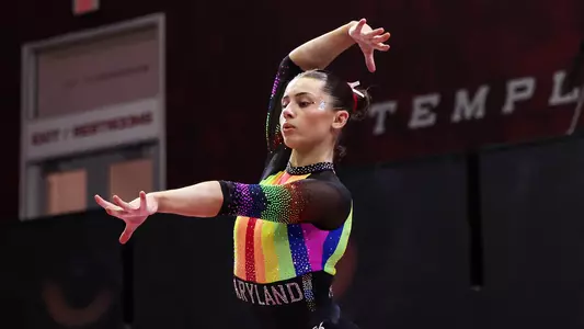 Maddie Komoroski Action Shot on beam at Temple