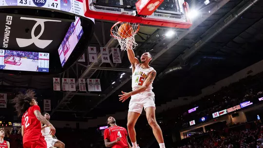 Collin Metcalf dunking a basketball