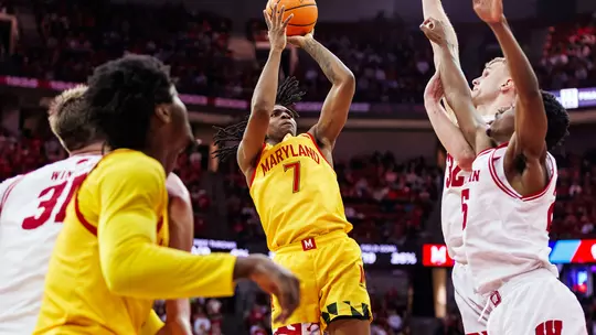 Andre Mills taking a jump shot during a game for Maryland men's baskletball