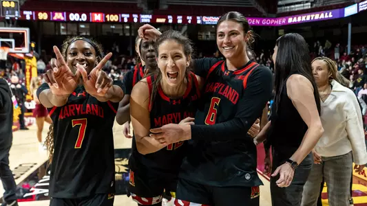 Okananwa, Garzon, Poffenbarger celebrate after a win at Minnesota