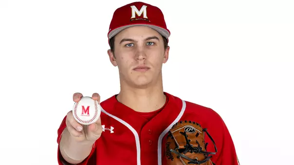 Nic Morlang Story Cover Photo, posed infront of white background holding ball