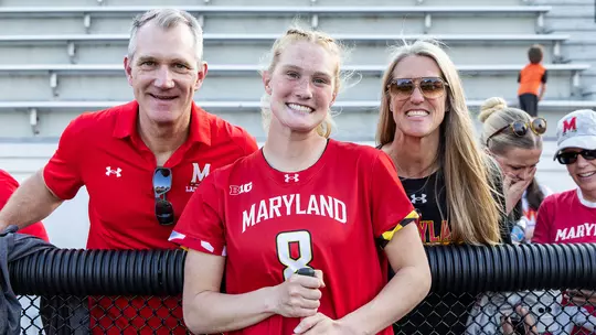 Lauren LaPointe with her parents after a Maryland women's lacrosse game in 2026