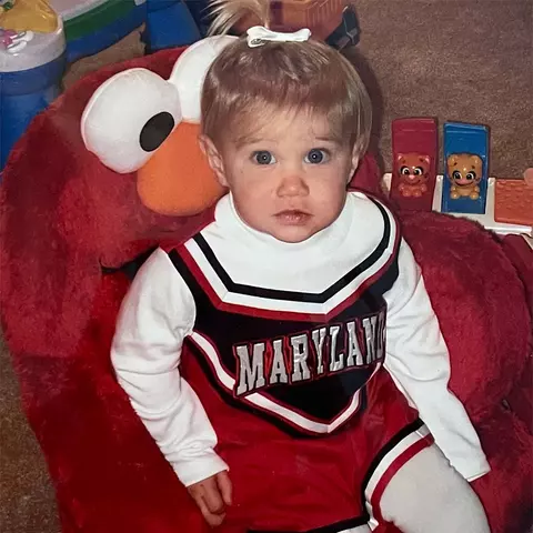 Lauren LaPointe as a toddler in the Maryland cheerleader outfit