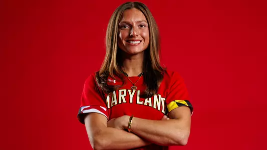 Caitlyn Cornwell red background posed action photo