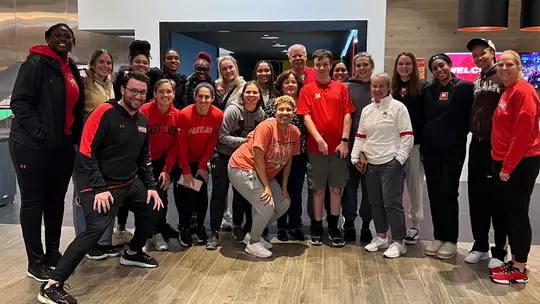 Scott Wilson with the Maryland women's basketball team at the new Barry P. Gossett Basketball Performance Center