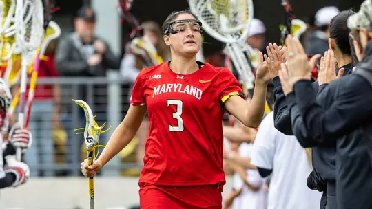 Kristen Shanahan giving her coaches a high five before a game