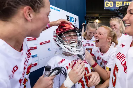 JJ Suriano celebrating with teammates after a win against Ohio State.