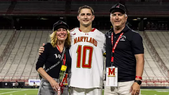 Braden Erksa and his parents at Senior Night in 2026