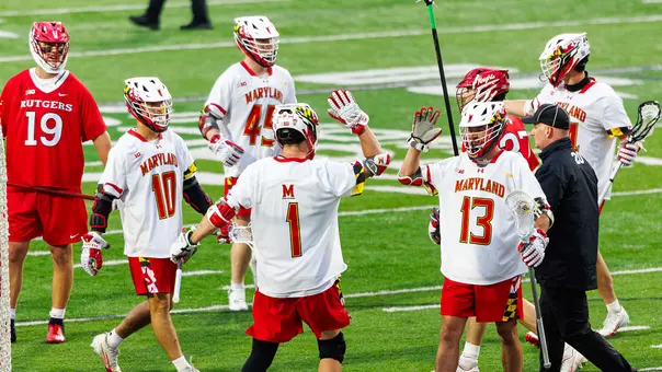 Zach Whittier and Eric Spanos give high-fives