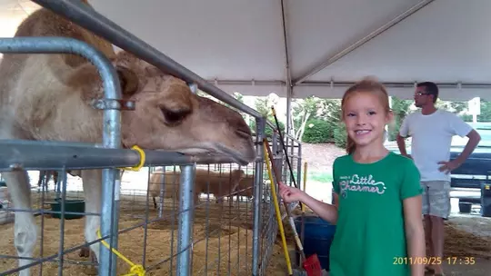 Jaylee Williams as a youth with a camel