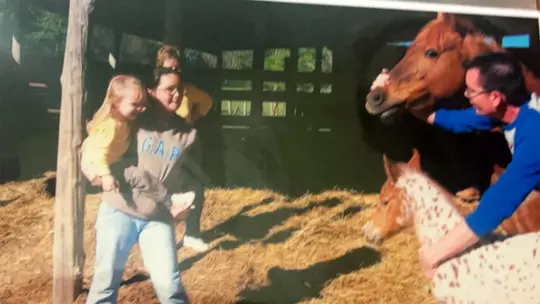 Jaylee Williams as a youth with her family at their farm