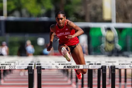 Tudy Spencer competes at the UCF Black and Gold Meet