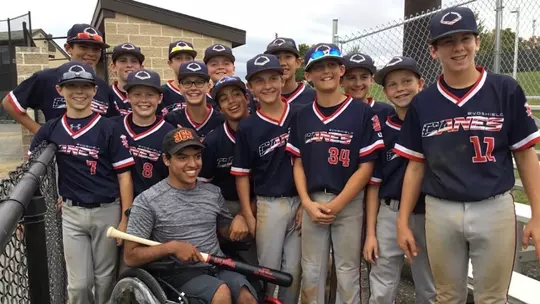 Diego Mendez with David's travel baseball team at a tournament