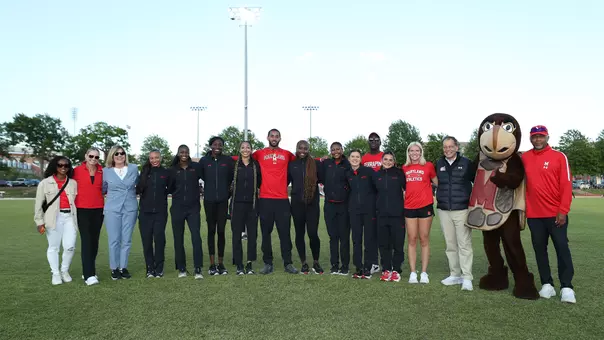 Maryland Athletes And Coaches Pose With Jim Smith And Diana Sabau On Senior Day