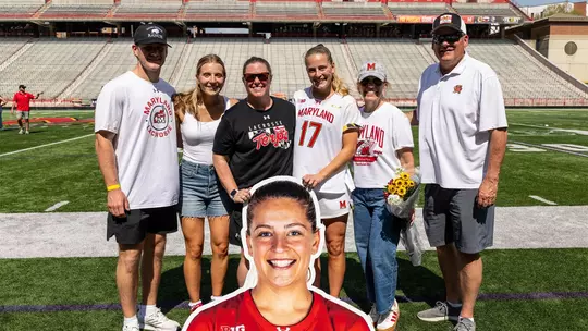 Maddy Sterling with her family and coaches on Senior Day
