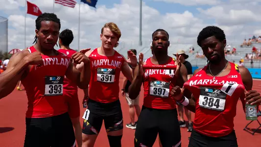 Morman, Leach, Spikes, and Ford all pose after competing in the 4x100 at the Big Ten Championships