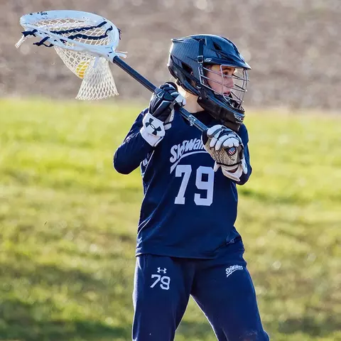 JJ Suriano playing lacrosse as a youth