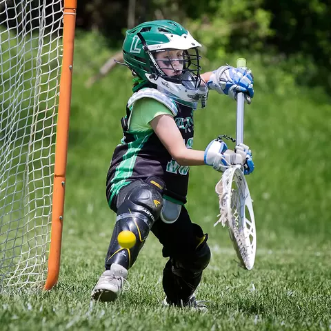 JJ Suriano playing lacrosse as a youth