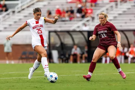 Abigail Stager dribbling a ball versus Fordham 8/16
