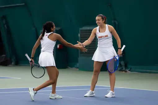 Emma Ghirardato and Diya Challa dapping each other up in 2025