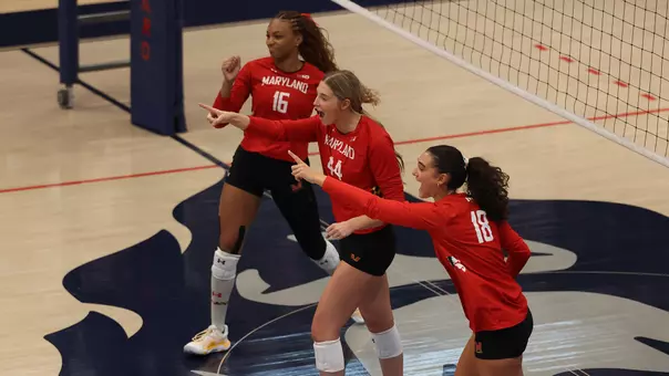 Maryland celebrates a kill against Howard
