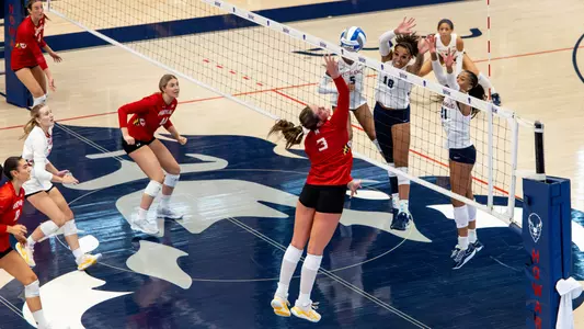 Ava Brown Action Shot Playing at Howard Going up for Hit