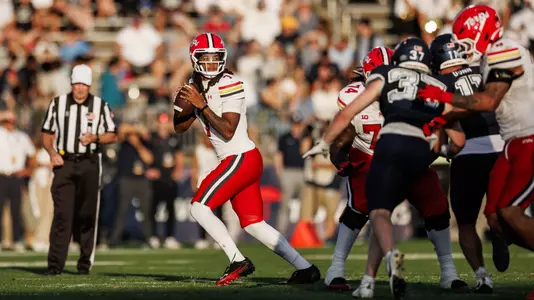 Malik Washington dropping back to pass during Maryland's win at UConn on September 12, 2026