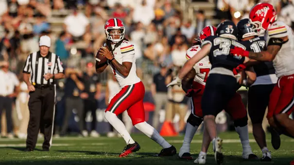 Malik Washington dropping back to pass during Maryland's win at UConn on September 12, 2026