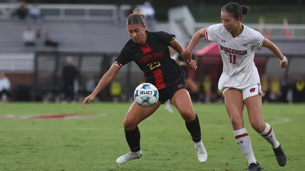 Morgan Shannon battles for possession against Wisconsin
