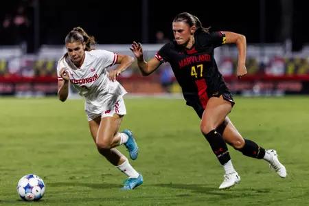Ellie Egeland dashing for a ball versus Wisconsin