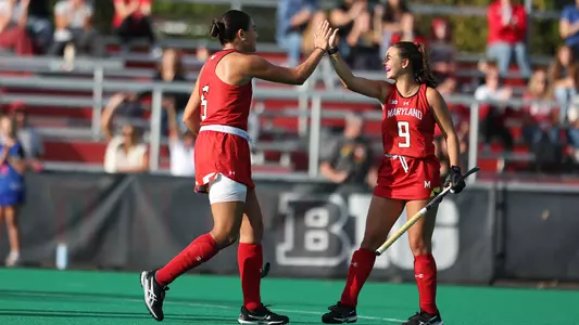 Francisca Eschoyez and Babs van Hest celebrate a goal against Rutgers