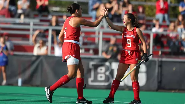 Francisca Eschoyez and Babs van Hest celebrate a goal against Rutgers