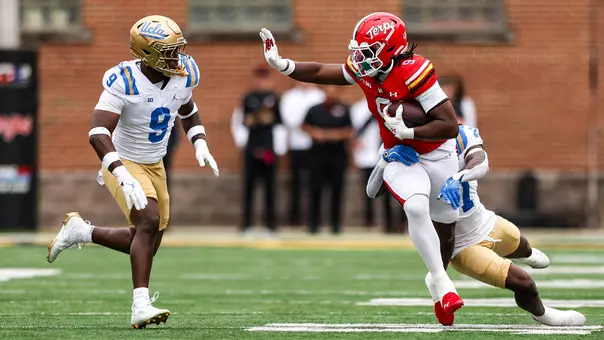 Dorian Fleming takes a reception up the field against UCLA