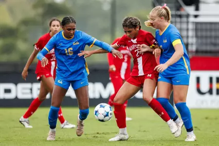 Kamryn Cole keeping the ball away versus UCLA