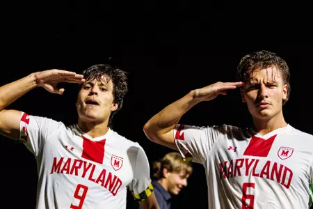 Leon saluting with teammate