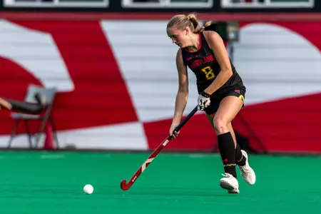 Ella Beach receives a pass against Towson