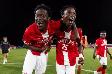 Maxwell Sekyi and Dennis Kalanzi celebrate together