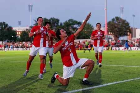 Rodrigo posing in celebration on the field