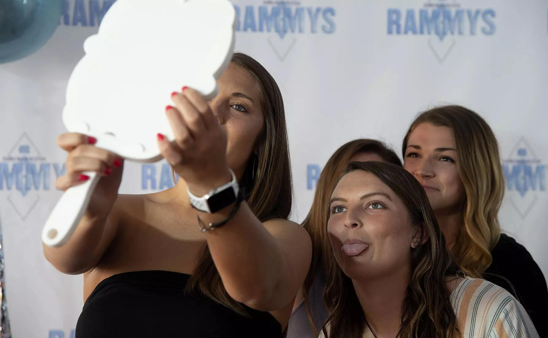 Softball players take a selfie before the Rammys.