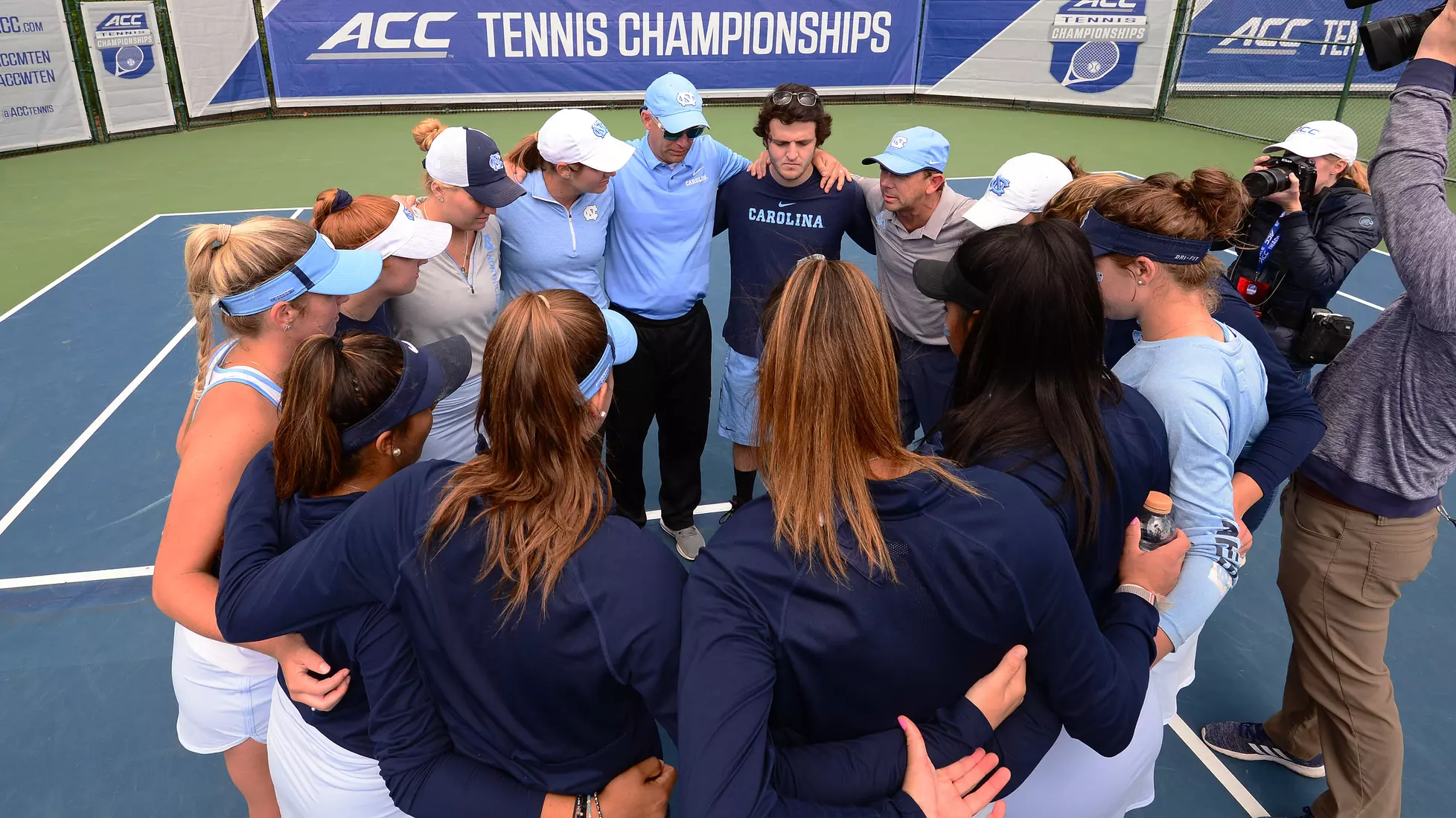 The Tar Heels huddle on the court.