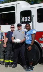 Tar Heels Present Game Balls To Orange County Fire Stations