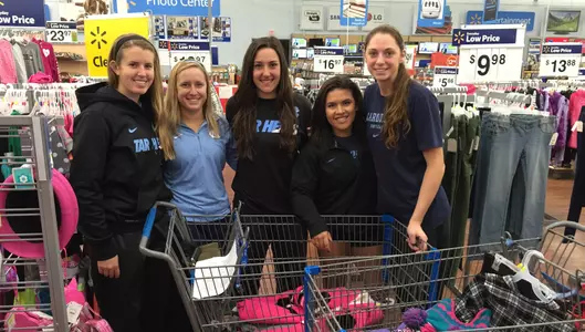 Softball "Shares Its Holiday" With Family In Need