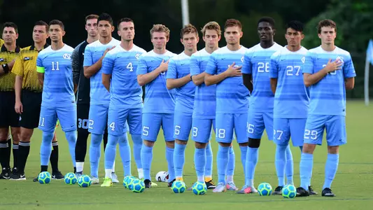UNC lines up for the National Anthem..