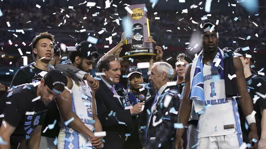 UNC celebrates with the national championship trophy.