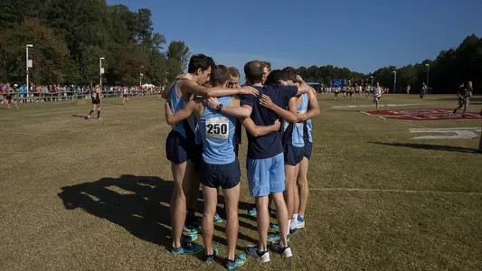 The Tar Heels huddle before the race.
